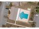 Aerial view of the community pool featuring lounge chairs and parking nearby at 299 Winter Ridge Blvd # 299, Winter Haven, FL 33881