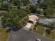 Aerial view of the home, showcasing its front yard, driveway and mature trees at 320 Boger S Blvd, Lakeland, FL 33803