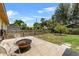Backyard with a metal fire pit, a fenced yard, and a patio at 320 Boger S Blvd, Lakeland, FL 33803