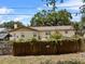 Charming home with a fenced backyard offering privacy and space for outdoor enjoyment and entertaining at 320 Boger S Blvd, Lakeland, FL 33803