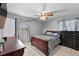 Bedroom featuring hard surface floors, a bed and a ceiling fan at 320 Boger S Blvd, Lakeland, FL 33803