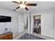 Bedroom featuring tile floors, a ceiling fan, a closet, and natural light at 320 Boger S Blvd, Lakeland, FL 33803