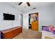 Bedroom featuring hard surface floors, a ceiling fan and a closet at 320 Boger S Blvd, Lakeland, FL 33803