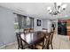 Bright dining area with large windows, modern chandelier, and tile flooring at 320 Boger S Blvd, Lakeland, FL 33803