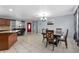 Open-concept dining area featuring tile floors and a red door at 320 Boger S Blvd, Lakeland, FL 33803