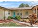 Charming single-story home with a bright blue front door and landscaped front yard at 320 Boger S Blvd, Lakeland, FL 33803