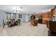 Spacious kitchen and dining area with wood cabinets, black appliances, and tile flooring at 320 Boger S Blvd, Lakeland, FL 33803