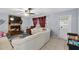 Cozy living room with a stone fireplace and tile floors at 320 Boger S Blvd, Lakeland, FL 33803