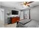 Bedroom features a ceiling fan, hard surface floors and a flat screen television at 320 Boger S Blvd, Lakeland, FL 33803