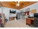 Large office features a wood ceiling, modern ceiling fan and neutral colored tile flooring at 320 Boger S Blvd, Lakeland, FL 33803
