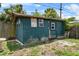 Backyard shed with stained siding and gated fence at 320 Boger S Blvd, Lakeland, FL 33803