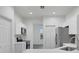 Modern kitchen featuring white cabinetry, stainless steel appliances, and ample counter space at 327 Cloverdale Rd, Winter Haven, FL 33884