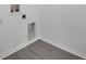 Image showing a laundry area with gray flooring and washing machine hookups at 327 Cloverdale Rd, Winter Haven, FL 33884