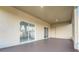 Large screened patio features a ceiling fan and sliding glass doors for easy access at 327 Cloverdale Rd, Winter Haven, FL 33884