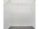 Spacious walk-in closet with wire shelving, offering ample storage in a neutral space at 327 Cloverdale Rd, Winter Haven, FL 33884