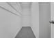 Large, empty walk-in closet with wire shelving perfect for organizing clothes and accessories at 327 Cloverdale Rd, Winter Haven, FL 33884
