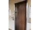 Interior view of an elevator with wood-paneled walls and stainless steel accents and control buttons at 333 Lake Howard Nw Dr # 312D, Winter Haven, FL 33880