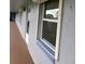 Exterior view of condo building with walkway, windows, and door at 333 Lake Howard Nw Dr # 312D, Winter Haven, FL 33880