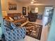 Open living room with tile flooring, modern furnishings, and natural light at 333 Lake Howard Nw Dr # 312D, Winter Haven, FL 33880