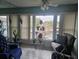 Relaxing sunroom with seating area, plants, and bright windows at 333 Lake Howard Nw Dr # 312D, Winter Haven, FL 33880