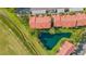 Aerial view of landscaped community featuring well-maintained lawns and tranquil ponds at 351 Enclave Dr # 94, Lakeland, FL 33803