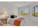 Serene bedroom with bright windows and a calm design with two lamps, perfect for relaxation at 351 Enclave Dr # 94, Lakeland, FL 33803