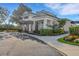 Elegant clubhouse entrance with beautifully landscaped surroundings and ample parking at 351 Enclave Dr # 94, Lakeland, FL 33803