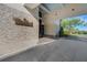Attractive entrance to the golf and country club with stone details and porte cochere at 351 Enclave Dr # 94, Lakeland, FL 33803