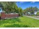 Well-maintained entrance to The Enclave with brick signage, lush landscaping, and a secure gate at 351 Enclave Dr # 94, Lakeland, FL 33803