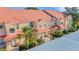 Attractive condo exteriors with well-maintained landscaping and covered parking at 351 Enclave Dr # 94, Lakeland, FL 33803