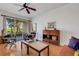 Comfortable living room with lots of light, hardwood floors, and a sliding glass door to the outside at 351 Enclave Dr # 94, Lakeland, FL 33803