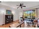 Bright living room with a ceiling fan, hardwood floors, and a sliding glass door with a view at 351 Enclave Dr # 94, Lakeland, FL 33803