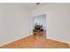 Bright room featuring wood laminate flooring leading to a living space at 351 Enclave Dr # 94, Lakeland, FL 33803