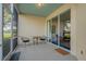 Relax on this screened patio featuring chairs, a table and access to the main living space at 351 Enclave Dr # 94, Lakeland, FL 33803