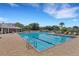 Outdoor swimming pool with lounge chairs surrounded by palm trees in community at 351 Enclave Dr # 94, Lakeland, FL 33803