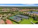 Aerial view of tennis courts surrounded by manicured landscaping and homes in the community at 351 Enclave Dr # 94, Lakeland, FL 33803