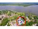 Aerial view of the home showcasing its proximity to the lake, complete with pool and dock at 3705 Pine Cir, Lake Wales, FL 33898