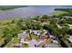 Aerial view of multiple waterfront homes featuring lake access, lush greenery, and tranquil surroundings at 3705 Pine Cir, Lake Wales, FL 33898