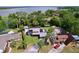 Aerial view of a home featuring solar panels, and a well manicured lawn at 3705 Pine Cir, Lake Wales, FL 33898