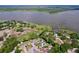Aerial view of waterfront homes, showcasing lake access, docks, and lush surroundings at 3705 Pine Cir, Lake Wales, FL 33898
