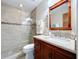 Well-appointed bathroom featuring a glass-enclosed shower and a stylish vanity with a granite countertop at 3705 Pine Cir, Lake Wales, FL 33898