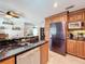 A bright kitchen showcasing stainless steel appliances, including a black stainless refrigerator and dishwasher at 3705 Pine Cir, Lake Wales, FL 33898