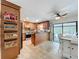 Spacious kitchen with tile floors, breakfast bar, stainless steel appliances and convenient access to the backyard patio at 3705 Pine Cir, Lake Wales, FL 33898