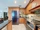 Beautiful kitchen with stainless steel appliances and wood cabinetry at 3705 Pine Cir, Lake Wales, FL 33898