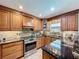 Updated kitchen featuring sleek countertops and stainless steel appliances at 3705 Pine Cir, Lake Wales, FL 33898