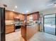 Well-equipped kitchen featuring stainless steel appliances and tiled floors at 3705 Pine Cir, Lake Wales, FL 33898