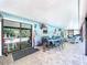 Spacious covered lanai with outdoor seating, dining area, and a view of the pool at 3705 Pine Cir, Lake Wales, FL 33898