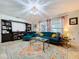Inviting living room with large windows and a classic furniture set at 3705 Pine Cir, Lake Wales, FL 33898