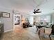 Comfortable living room with a ceiling fan, tile floors and access to other rooms, ideal for relaxing and entertaining at 3705 Pine Cir, Lake Wales, FL 33898