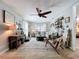 Bright and spacious living room featuring a modern ceiling fan, comfortable seating, and stylish decor at 3705 Pine Cir, Lake Wales, FL 33898